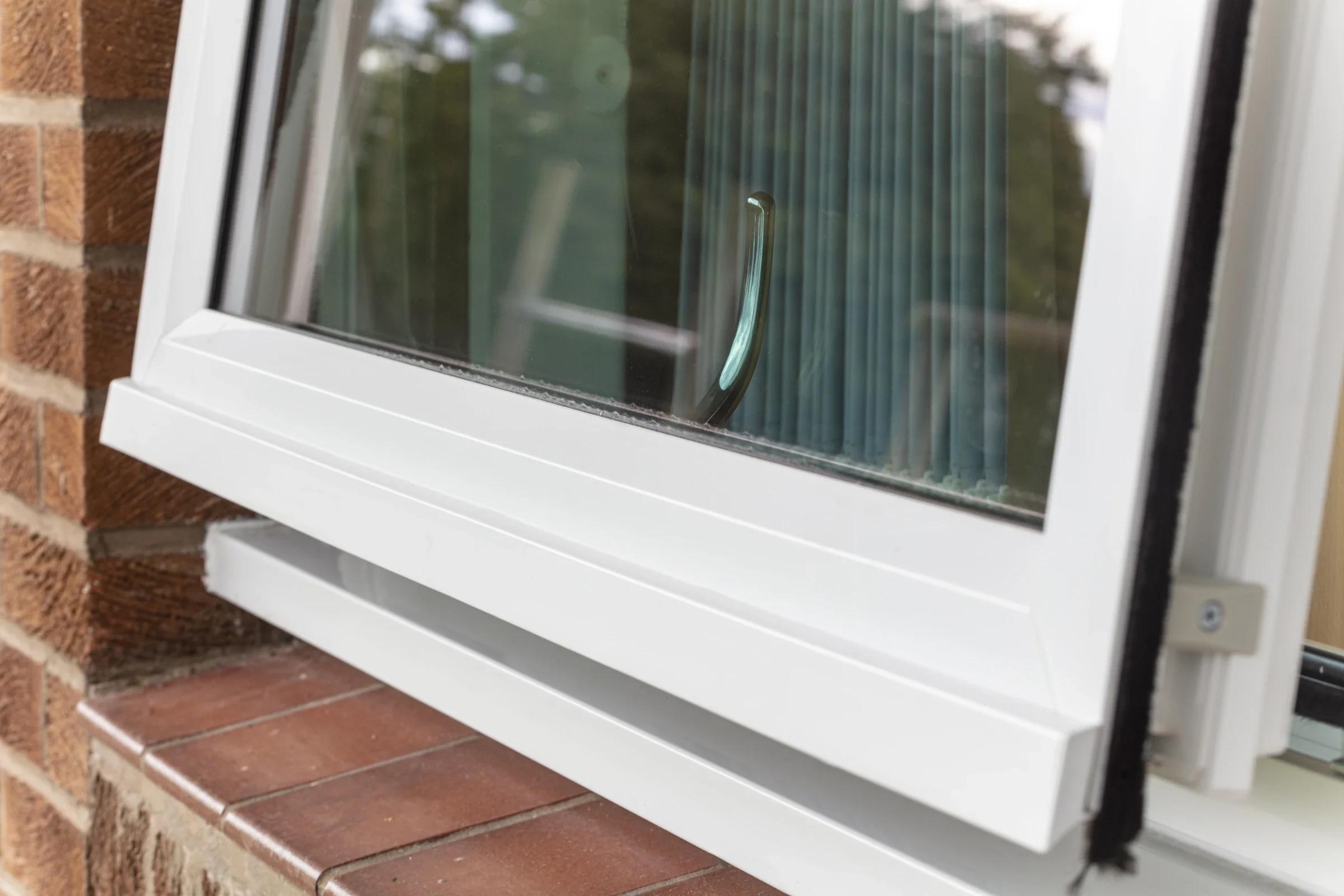 White uPVC reversible window rotated inward for cleaning