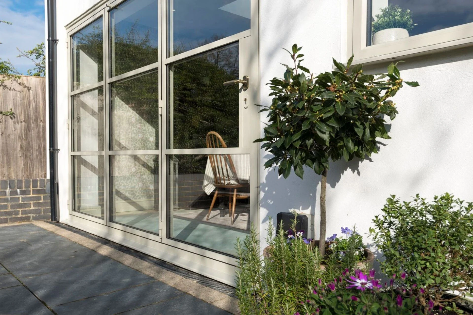 Black heritage bifold doors viewed from the patio