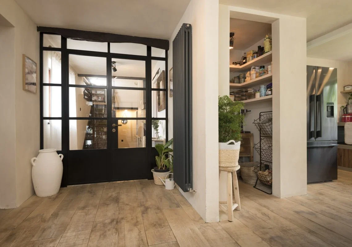 Black internal aluminium French doors with a solid lower panel
