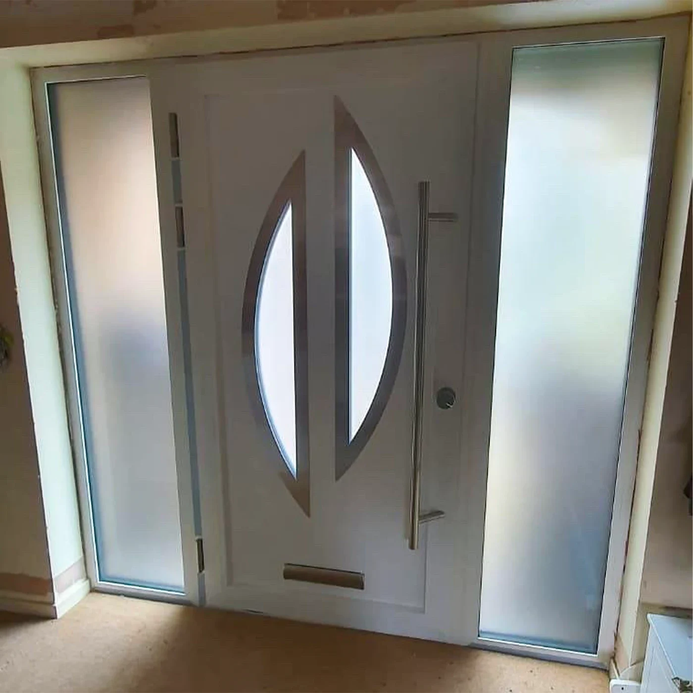 Interior view of an aluminium entrance door with frosted sidelights