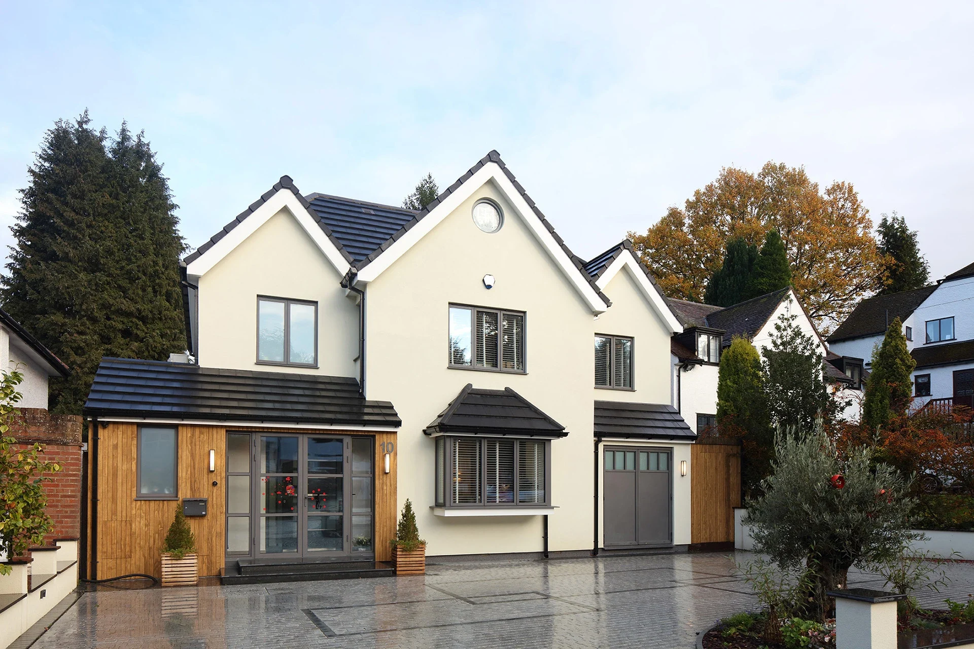 Aluminium windows coordinating across a detached house