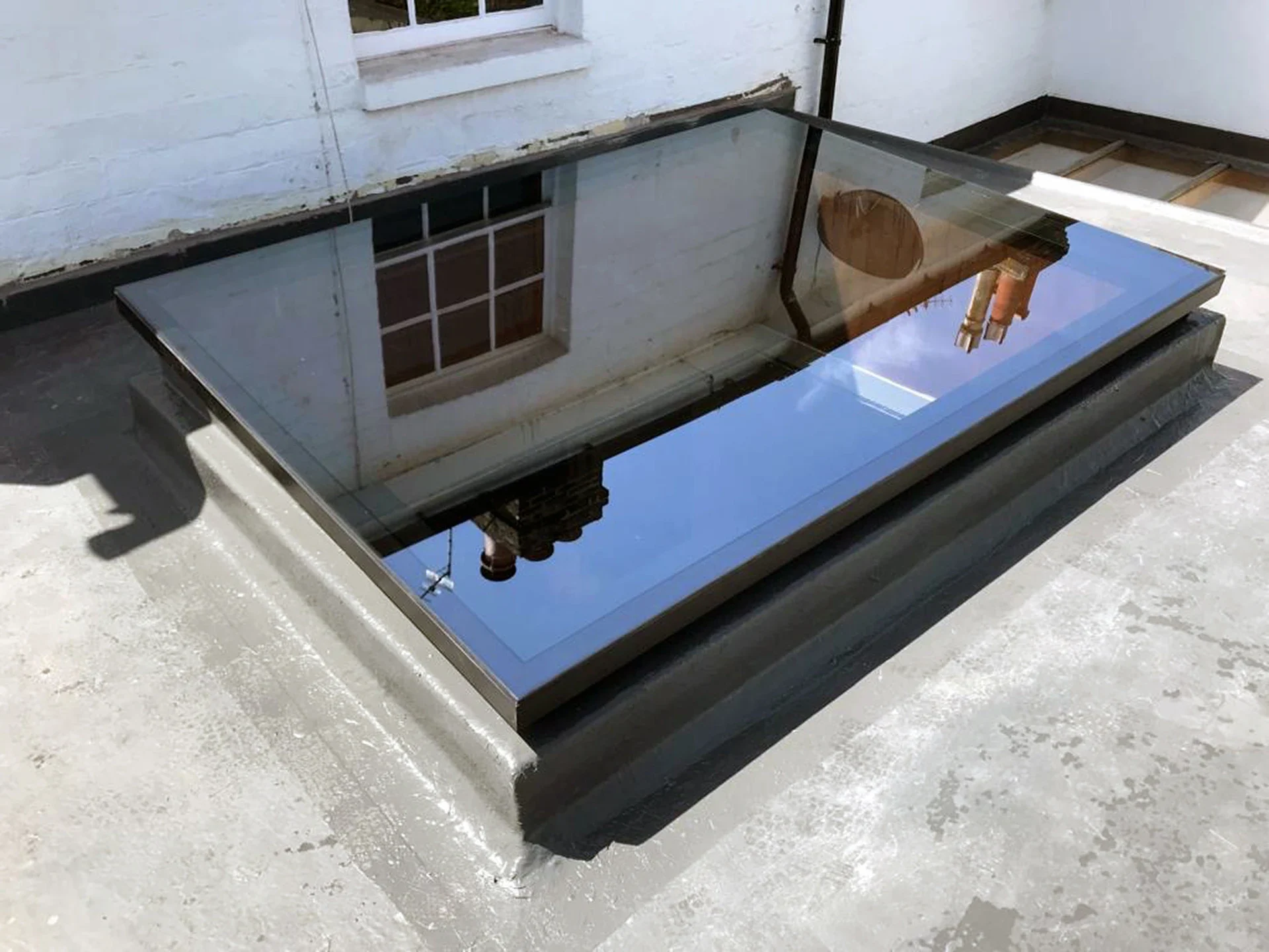 Flat glass rooflight installed on a finished flat-roof extension
