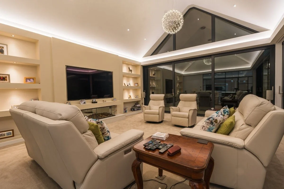 Lift-and-slide aluminium doors opening from a living room
