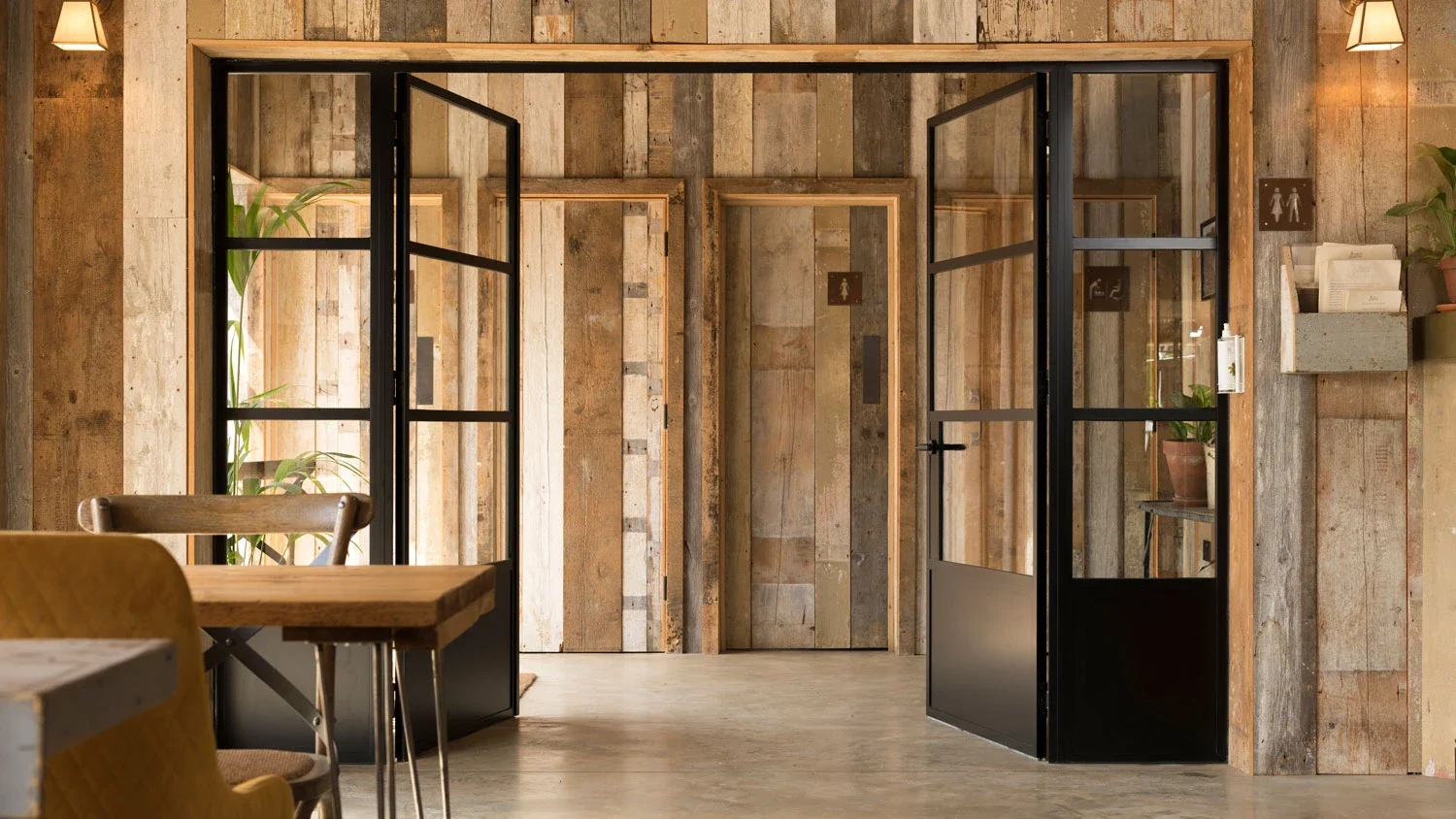Internal aluminium double doors opening into an adjoining room