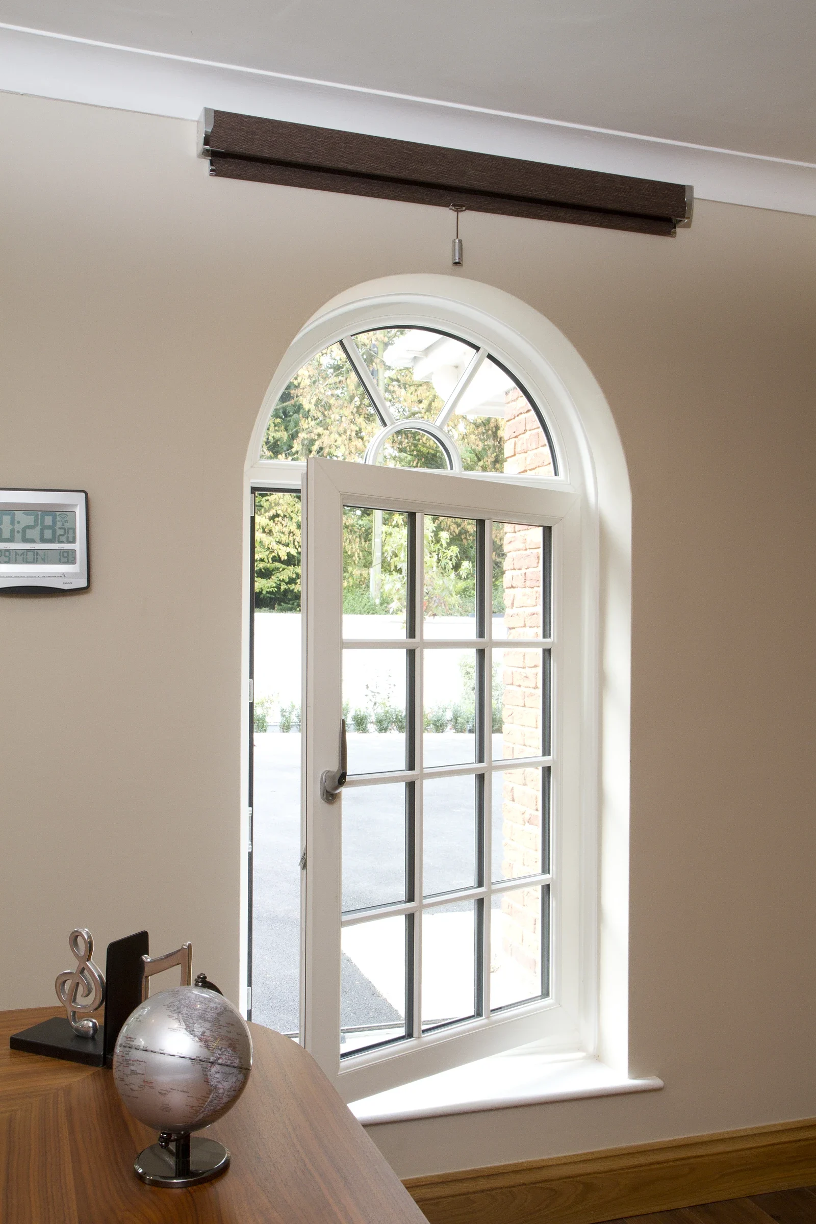 White arched uPVC tilt-and-turn window viewed from inside