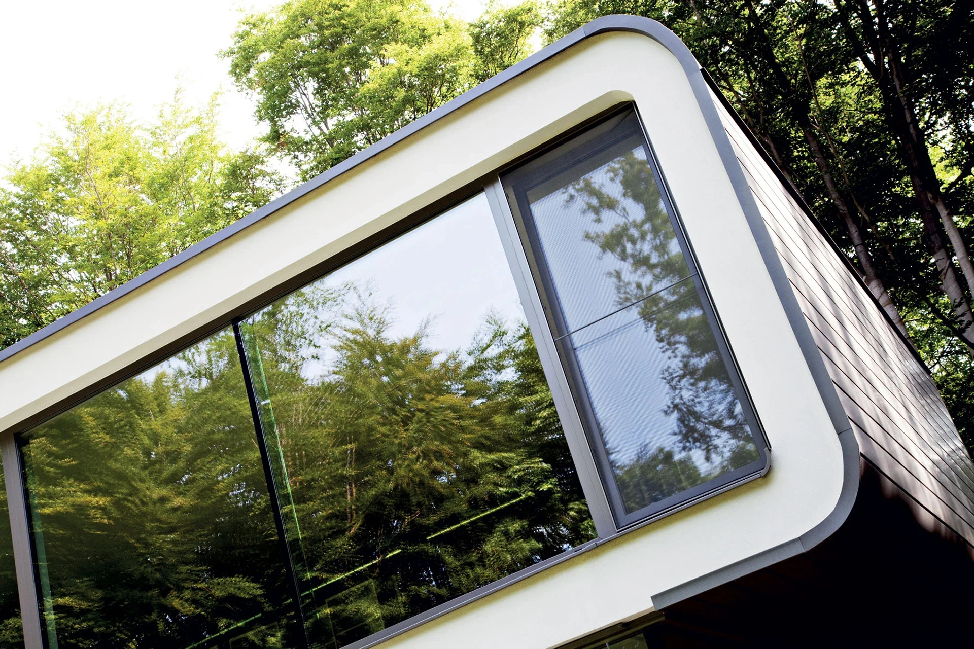Large aluminium tilt-and-turn glazing in a modern house