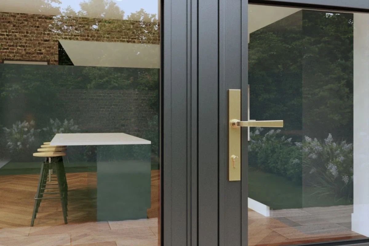 Close-up of a brass-toned heritage aluminium door handle