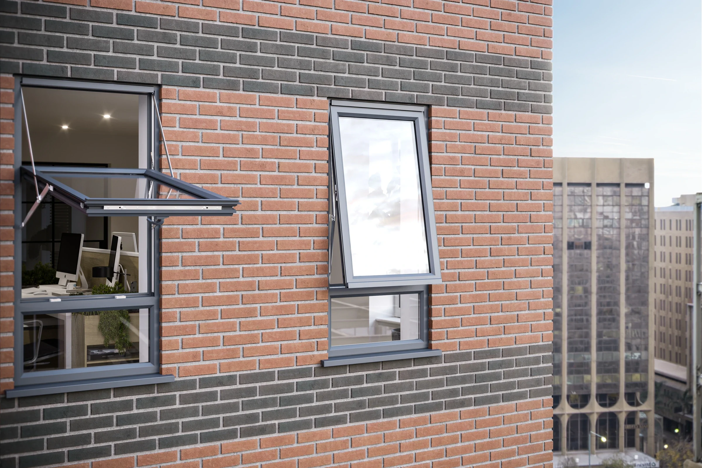 White uPVC reversible windows open on a brick building