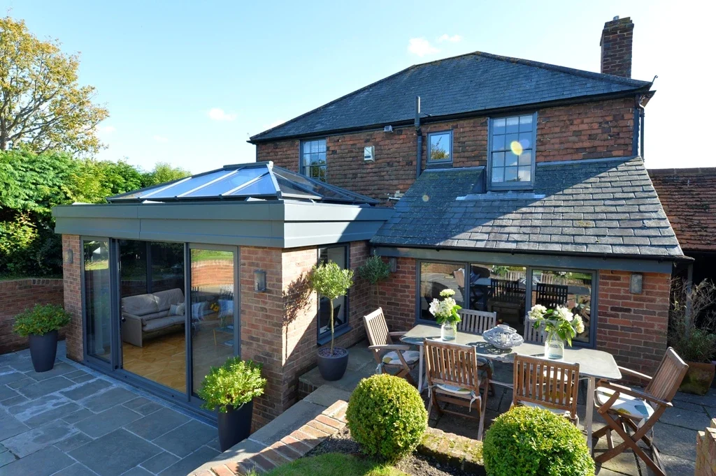 Roof lantern above a garden extension to a brick house