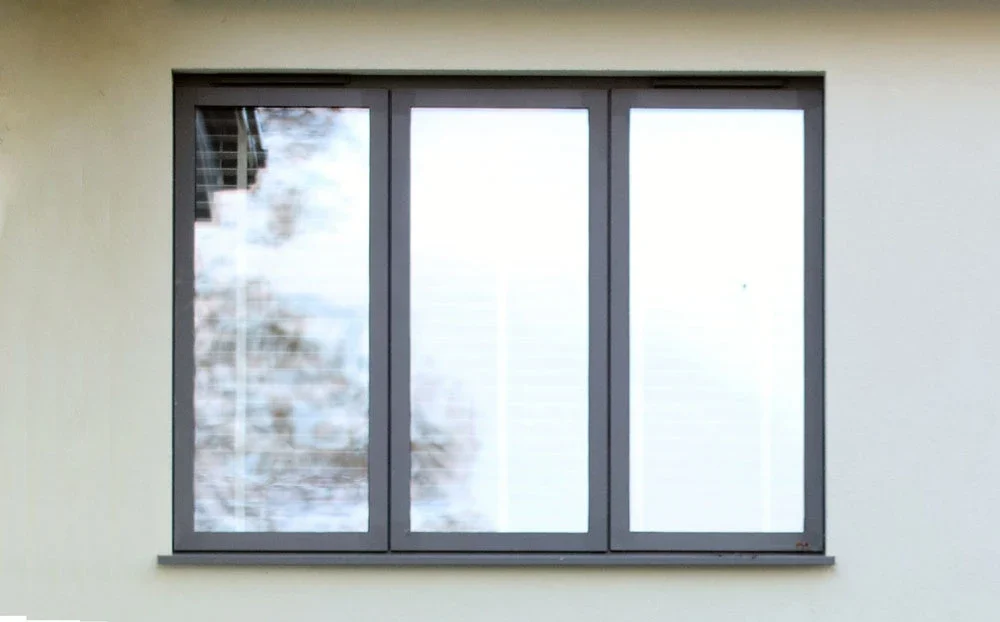 Grey steel-alternative aluminium window seen from outdoors