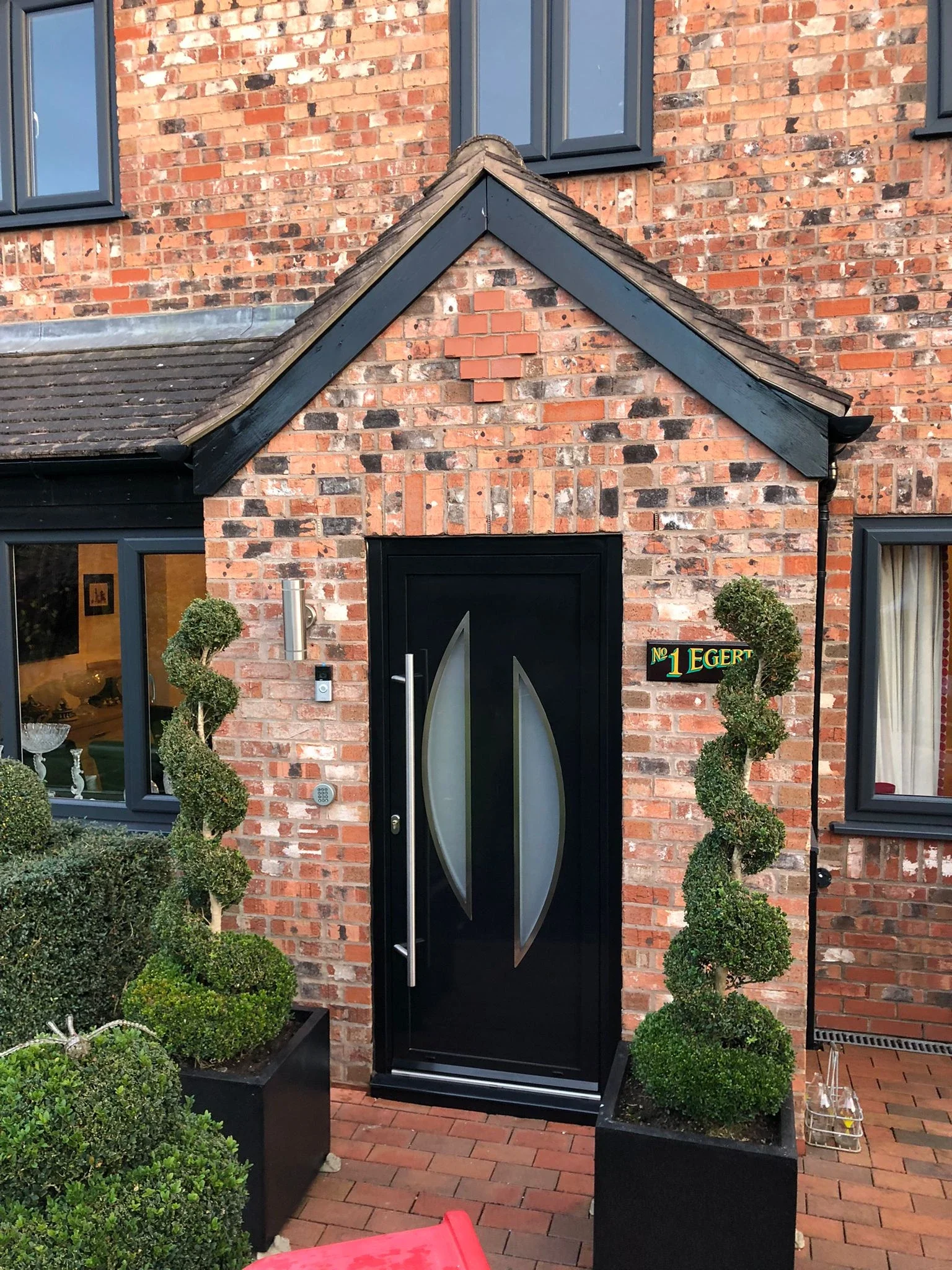 Installed aluminium entrance door with decorative glazing
